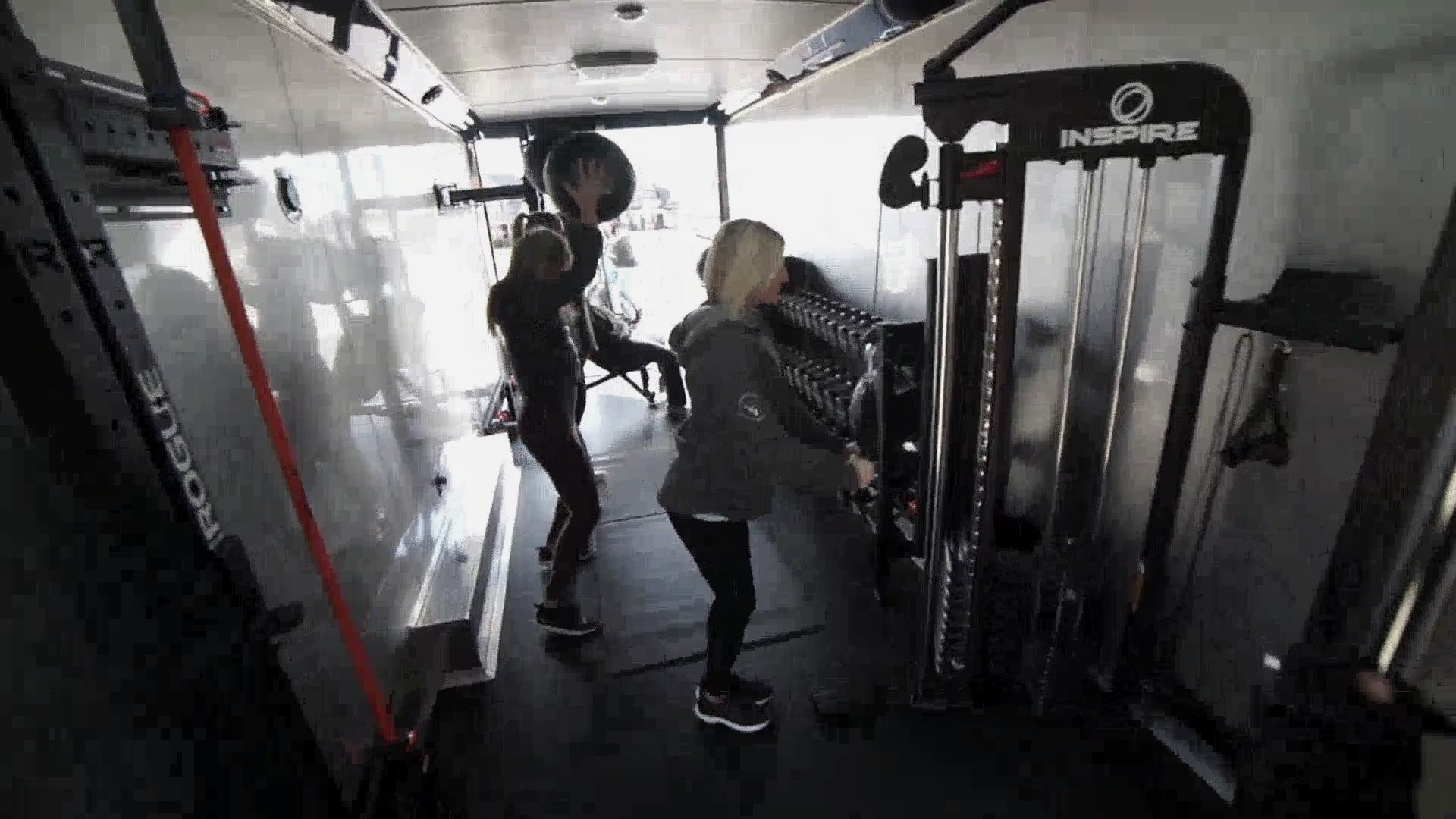 Clients training inside the mobile gym